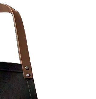 Close-up of a riveted tan leather apron strap fixed to charcoal canvas