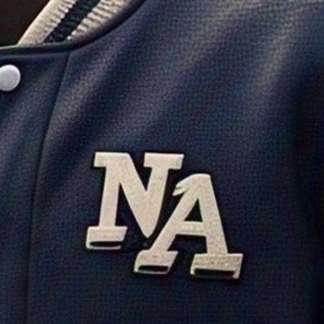 Close-up of a raised chenille chest patch on the navy melton body of a varsity jacket