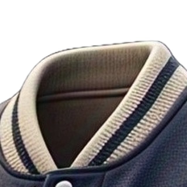 Close-up of the striped knitted rib collar of a navy and cream varsity jacket