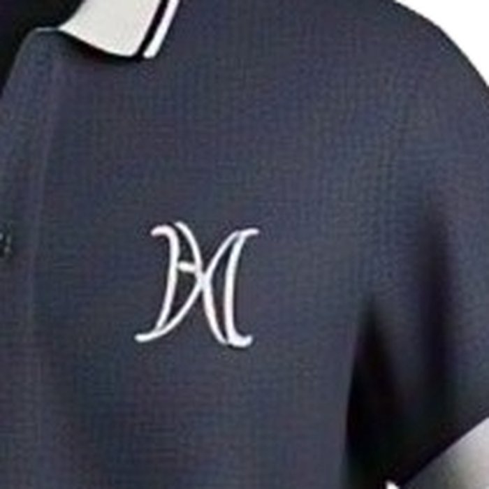 Close-up of an embroidered logo on the chest of a navy pique polo shirt